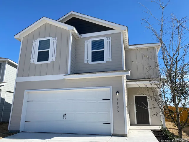 a front view of a house with a garage