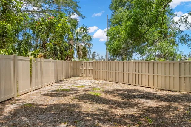 a view of backyard with tub