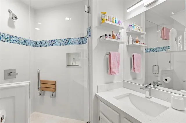 a view of a workspace with furniture and a flat screen tv