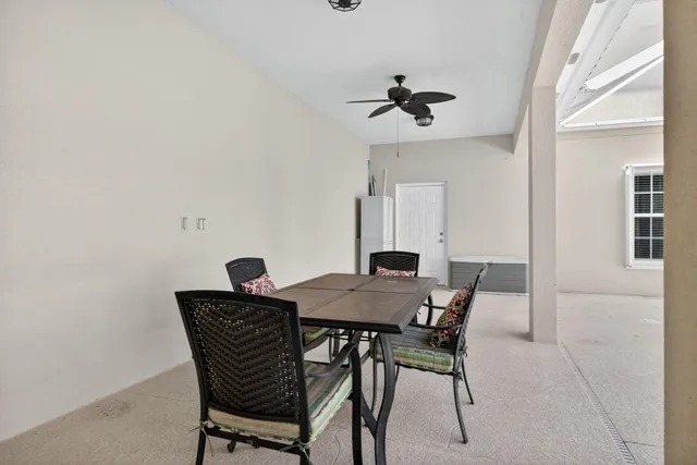 an aerial view of a house with a garden and lake view