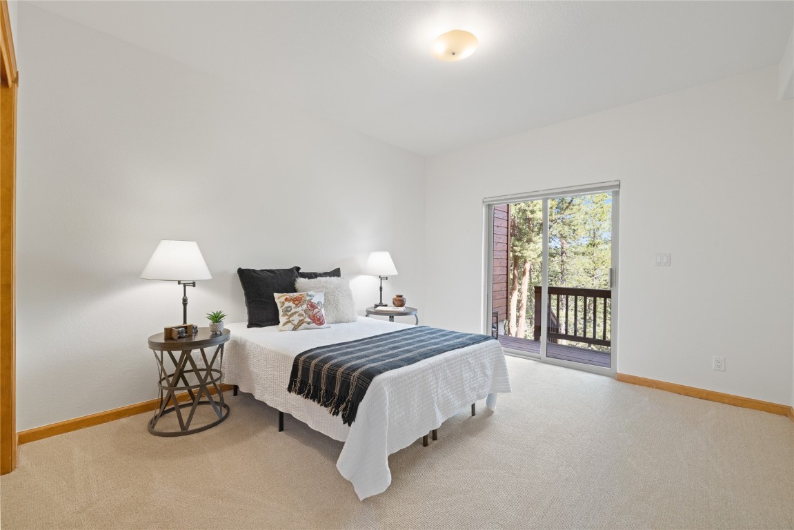 97 Lookout Ridge Drive, Unit 97 Dillon, CO 80435 - Photo 31 of 41 2nd bedroom with access to the lower level deck