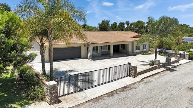 a view of house with outdoor space and sitting area