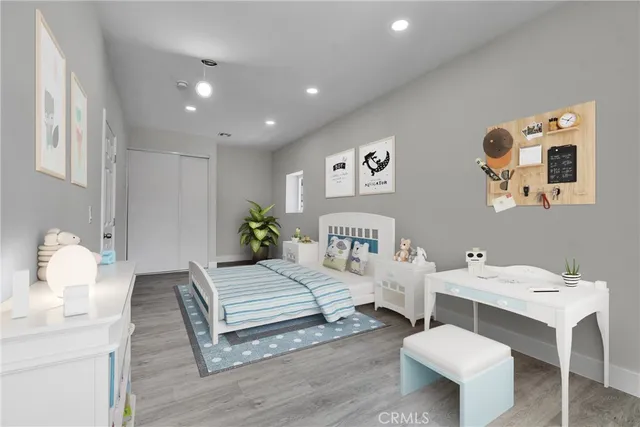 a spacious bedroom with a bed and a table