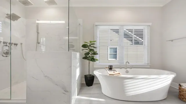 a bedroom with two beds and a chandelier