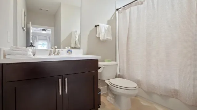 a backyard of a house with plants and trees