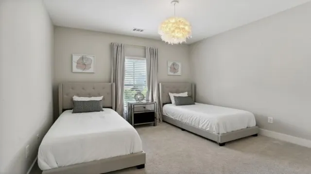a view of a patio with a table and chairs under an umbrella