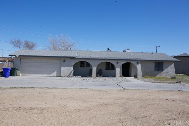 12447 Sholic Road Apple Valley, CA 92308 - Photo 1 of 1 a view of front of house with garage