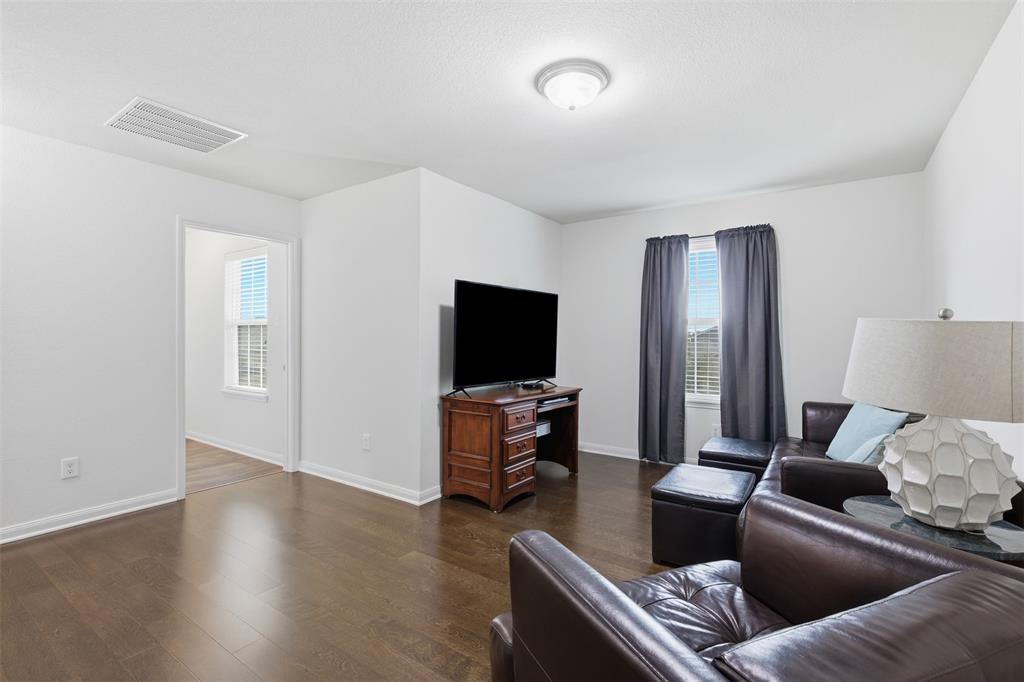 14229 Bridgeview Lane Dallas, TX 75253 - Photo 14 of 29 a living room with furniture and a flat screen tv