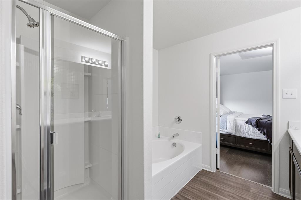 14229 Bridgeview Lane Dallas, TX 75253 - Photo 22 of 29 a bathroom with a tub and shower