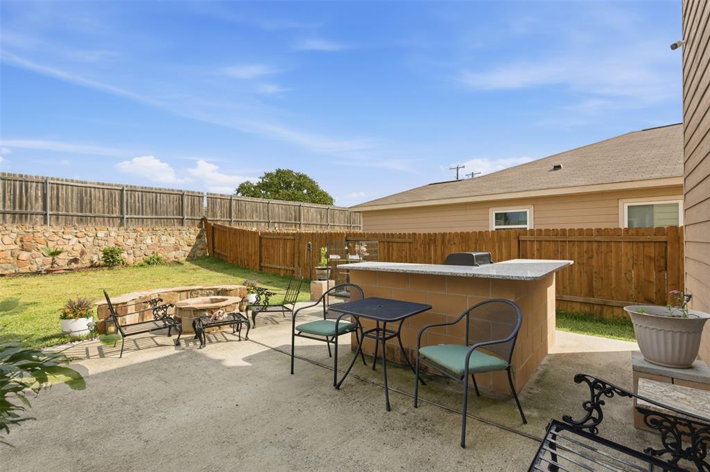 14229 Bridgeview Lane Dallas, TX 75253 - Photo 24 of 29 a dinning table and chairs in the patio