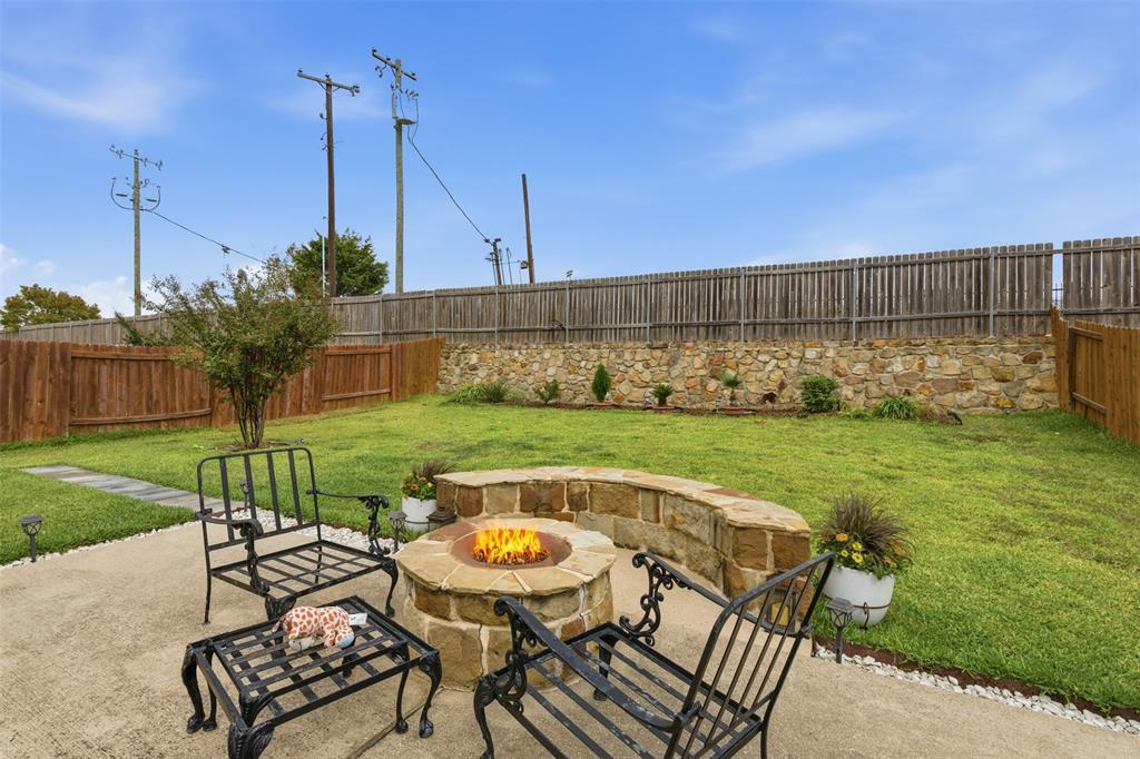 14229 Bridgeview Lane Dallas, TX 75253 - Photo 28 of 29 a view of a chair and table in the garden