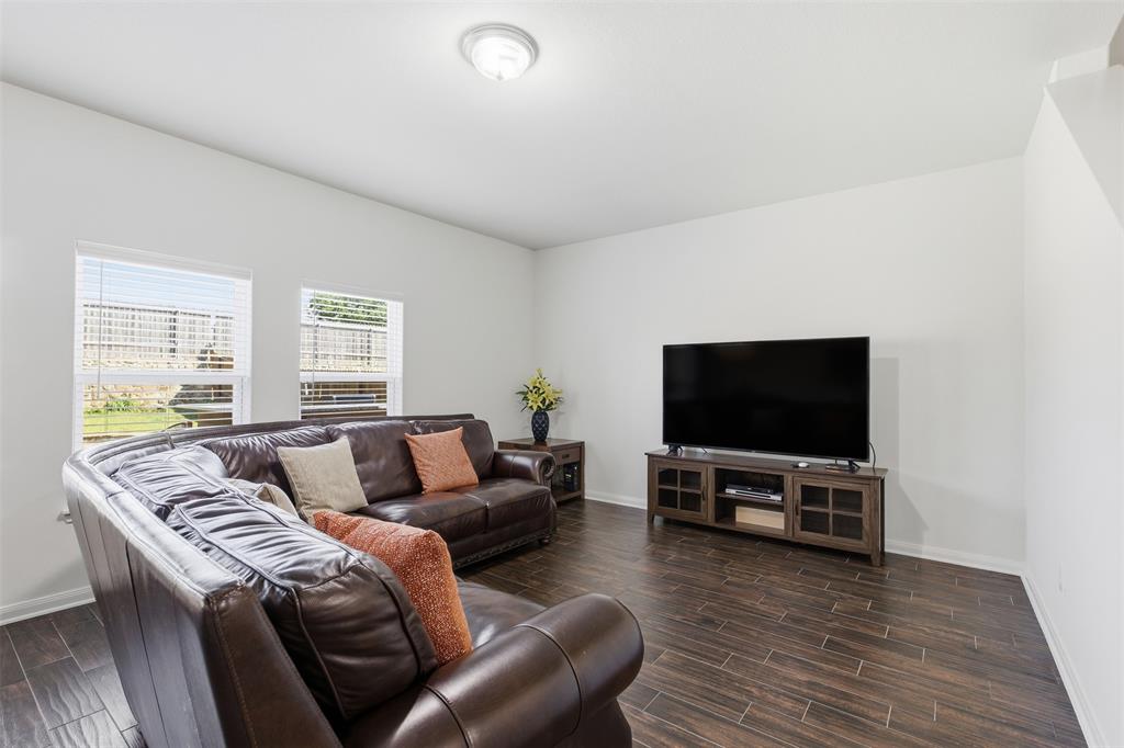 14229 Bridgeview Lane Dallas, TX 75253 - Photo 5 of 29 a living room with furniture and a flat screen tv
