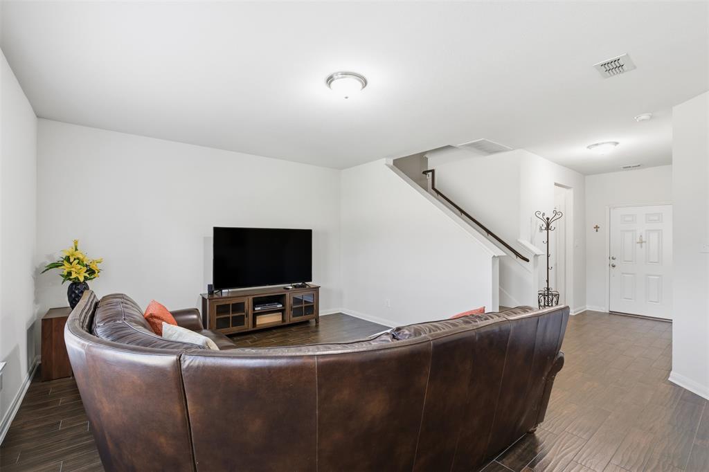 14229 Bridgeview Lane Dallas, TX 75253 - Photo 7 of 29 a living room with furniture and a flat screen tv