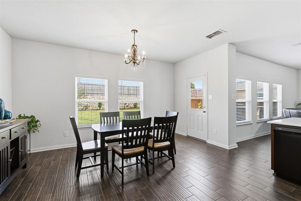 14229 Bridgeview Lane Dallas, TX 75253 - Photo 10 of 29 a view of a dining room with furniture window and wooden floor
