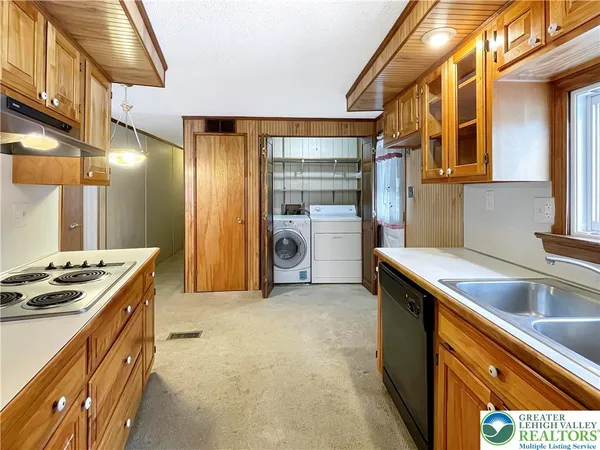 a kitchen that has a sink and a stove