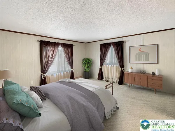 a bedroom with a bed dresser and a window