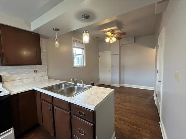 a bathroom with a sink a vanity and mirror