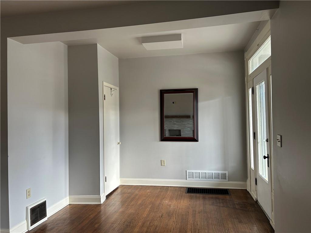 217 Arthur Street, Unit 1 Zelienople, PA 16063 - Photo 2 of 13 a view of a hallway with wooden floor