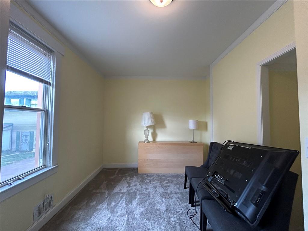 217 Arthur Street, Unit 1 Zelienople, PA 16063 - Photo 5 of 13 a living room with a bed furniture and a window