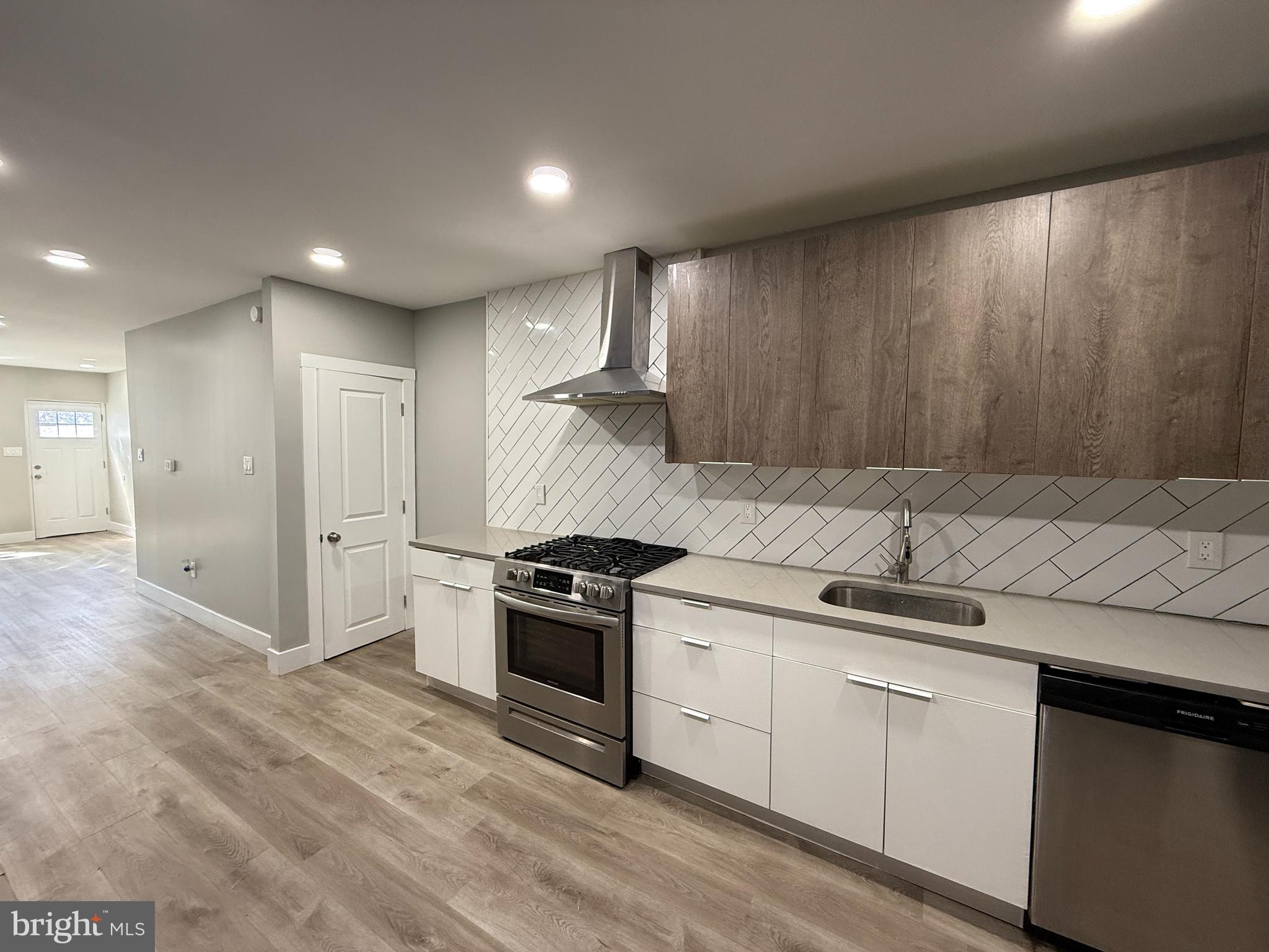 2943 Wharton Street Philadelphia, PA 19146 - Photo 12 of 36 a kitchen with a stove and a sink