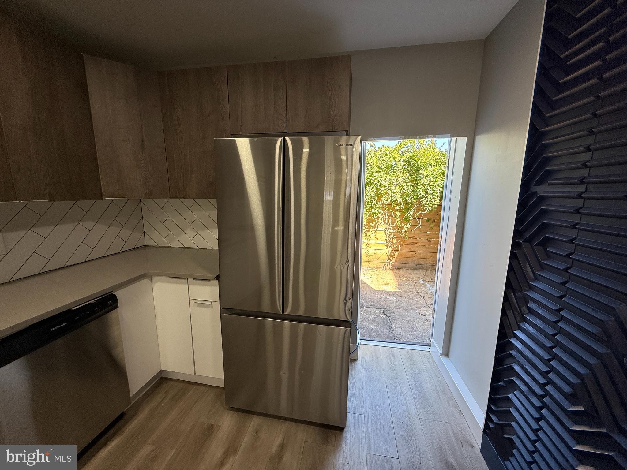2943 Wharton Street Philadelphia, PA 19146 - Photo 14 of 36 a kitchen with a refrigerator and wooden floor