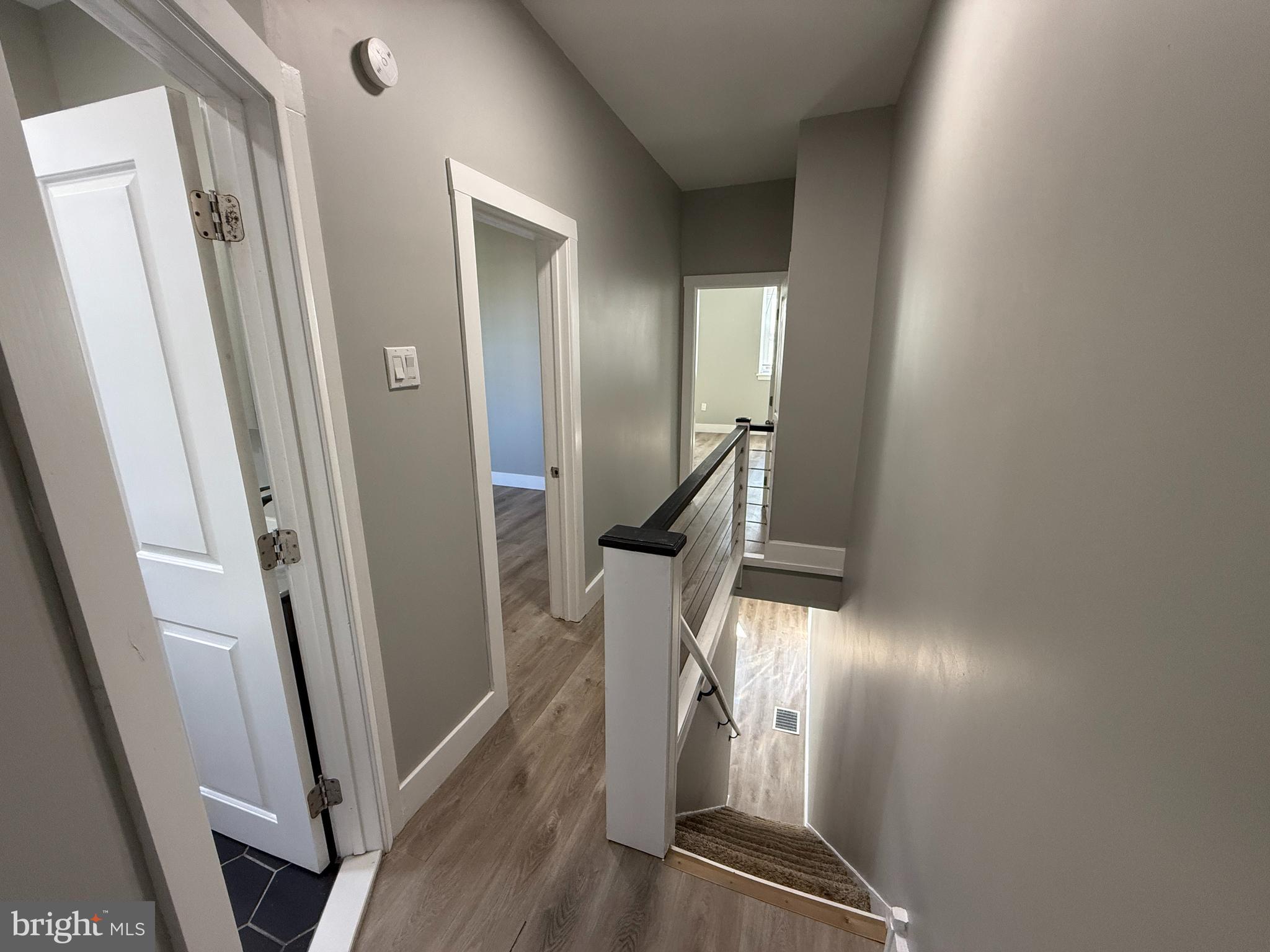 2943 Wharton Street Philadelphia, PA 19146 - Photo 18 of 36 a view of a hallway with wooden floor