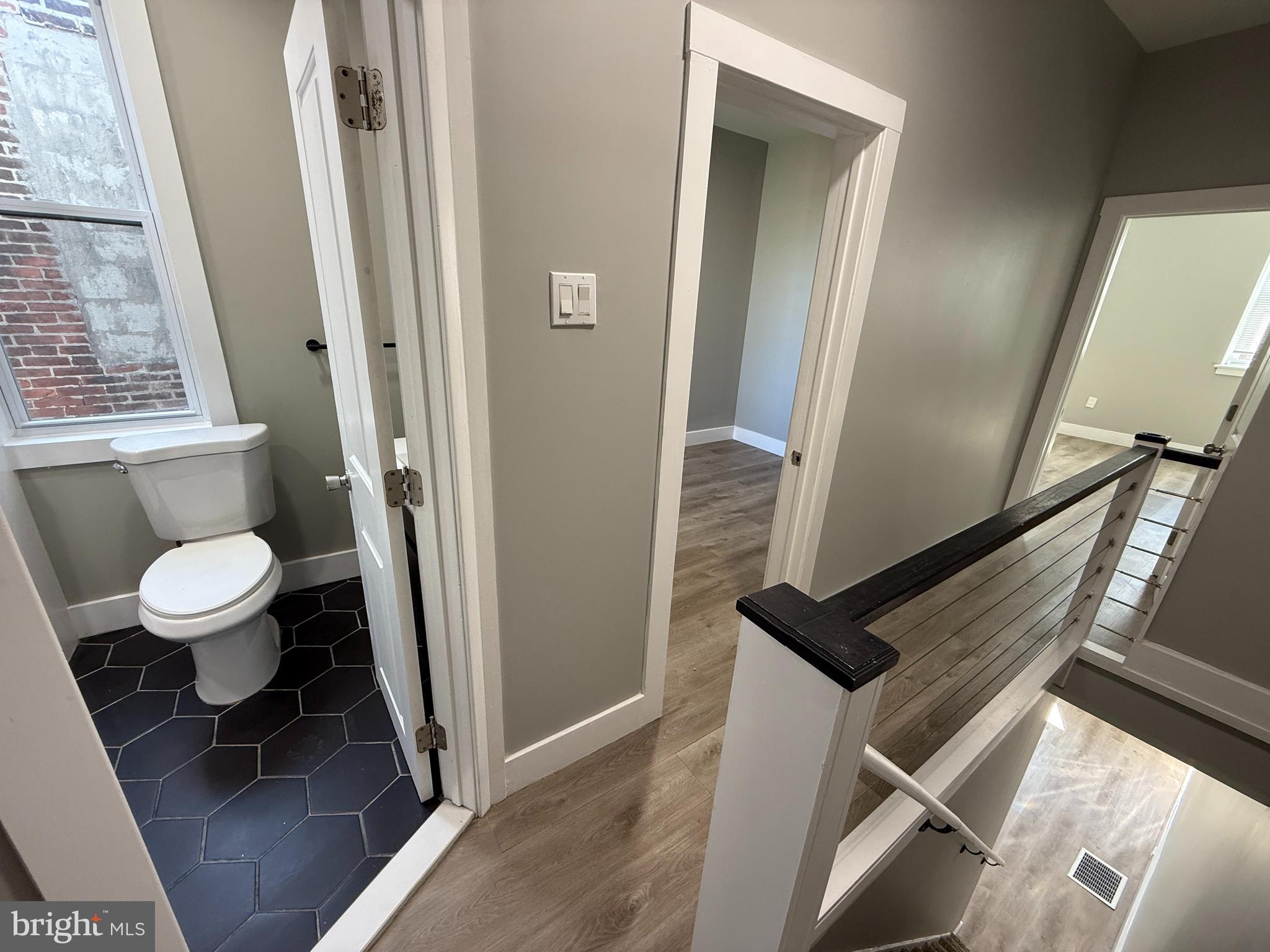 2943 Wharton Street Philadelphia, PA 19146 - Photo 19 of 36 a bathroom with a toilet and a shower