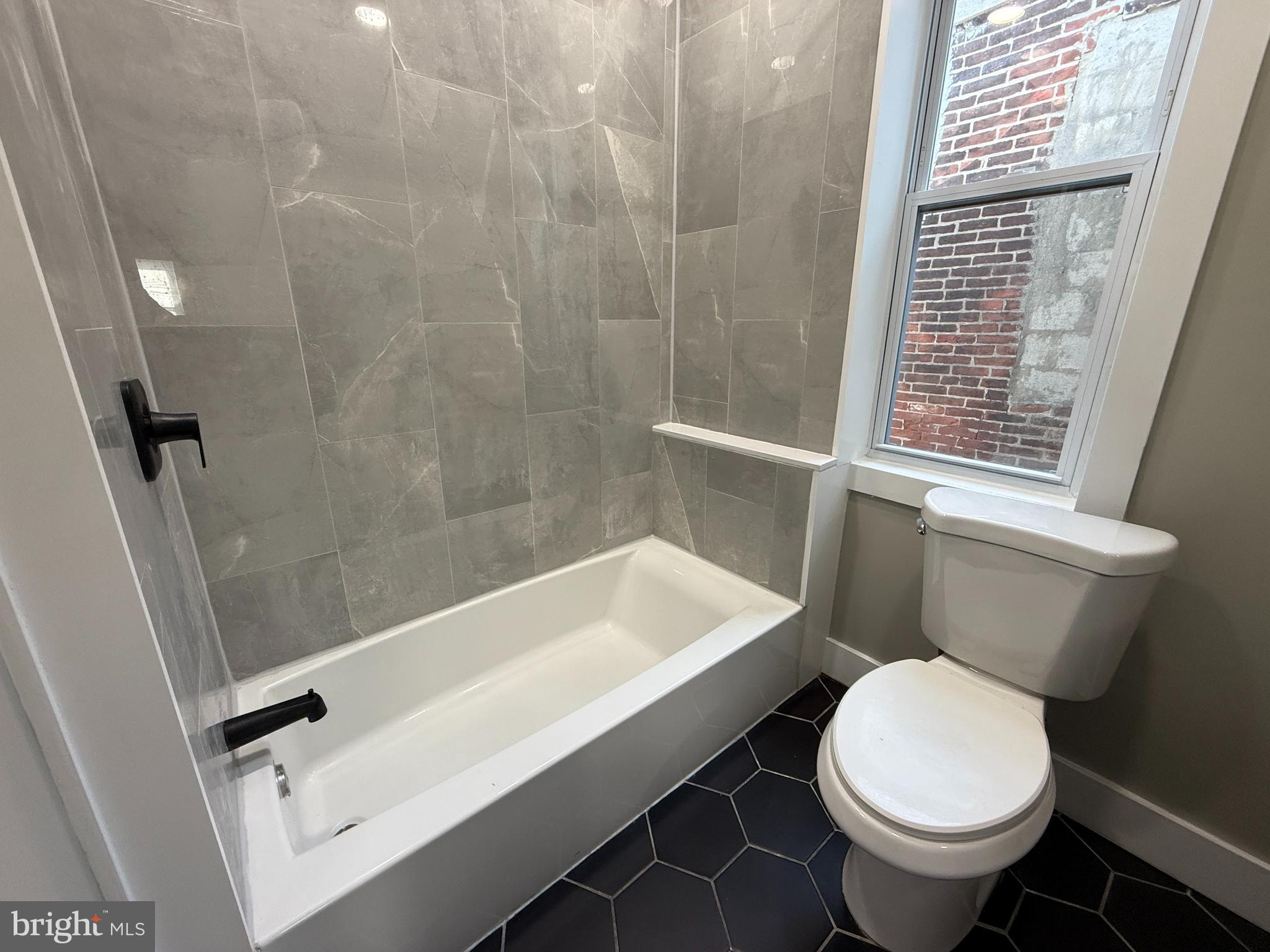 2943 Wharton Street Philadelphia, PA 19146 - Photo 20 of 36 a bathroom with a sink toilet and shower