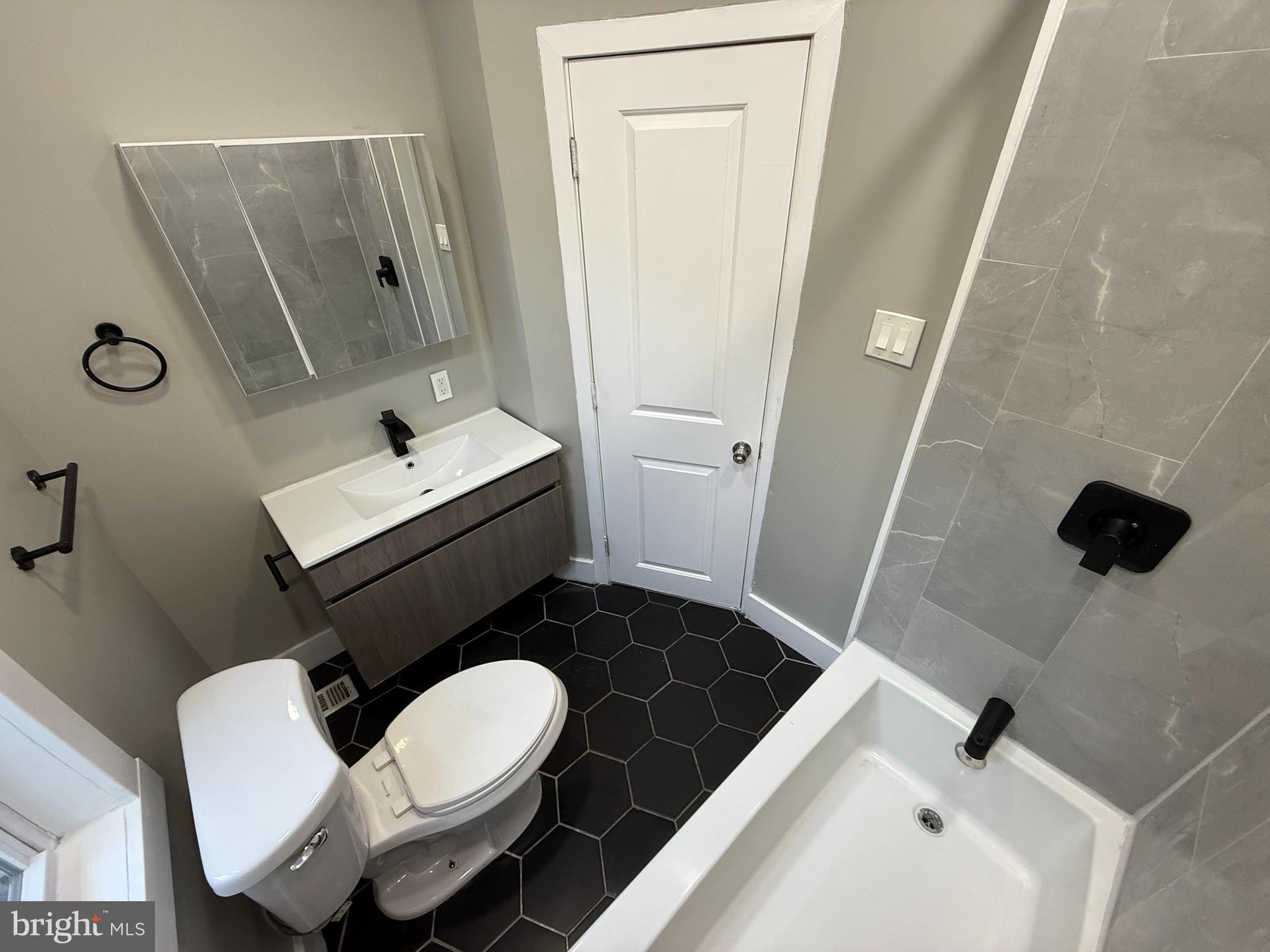 2943 Wharton Street Philadelphia, PA 19146 - Photo 21 of 36 a bathroom with a sink toilet and shower