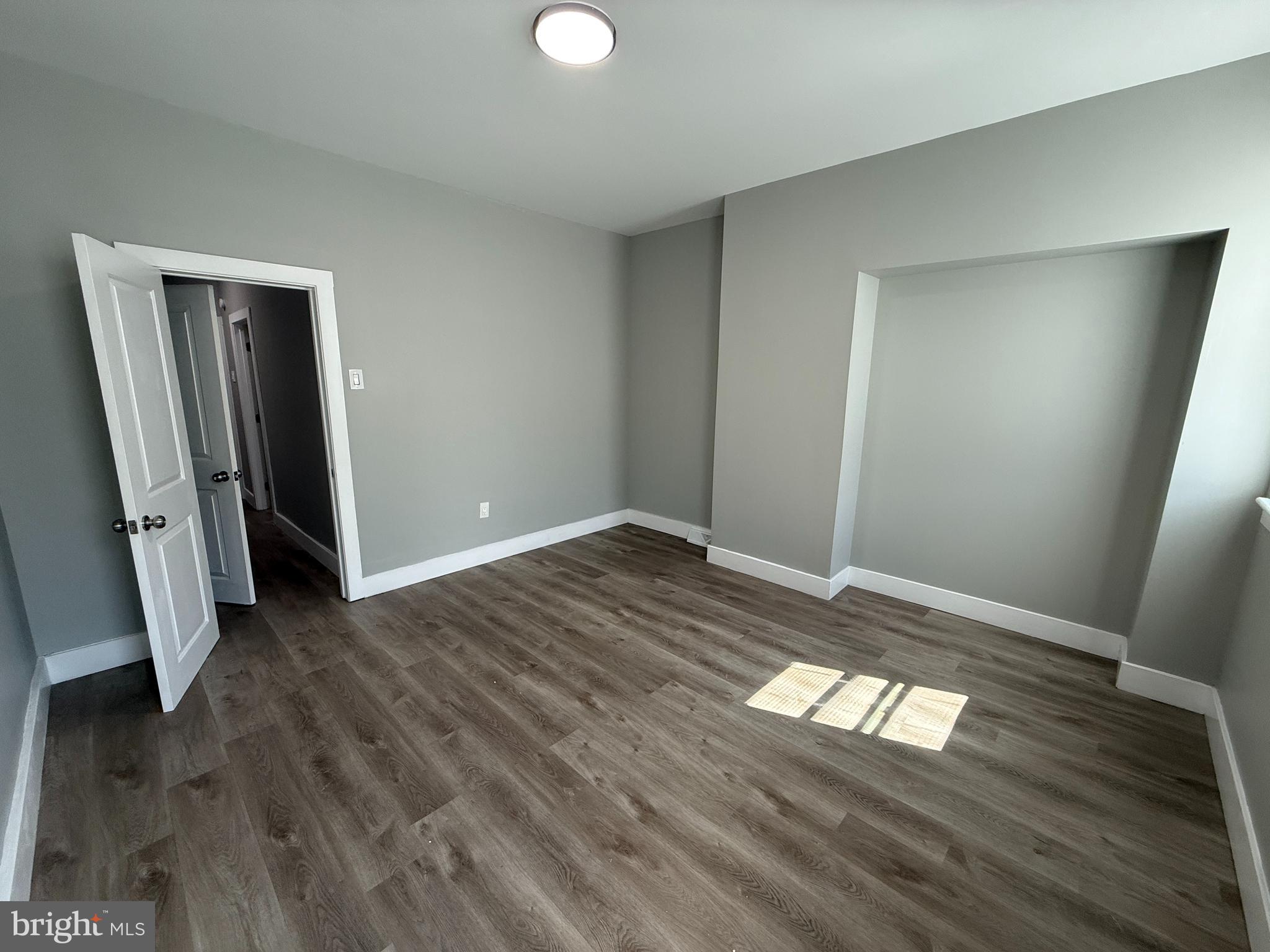 2943 Wharton Street Philadelphia, PA 19146 - Photo 23 of 36 a view of empty room with wooden floor