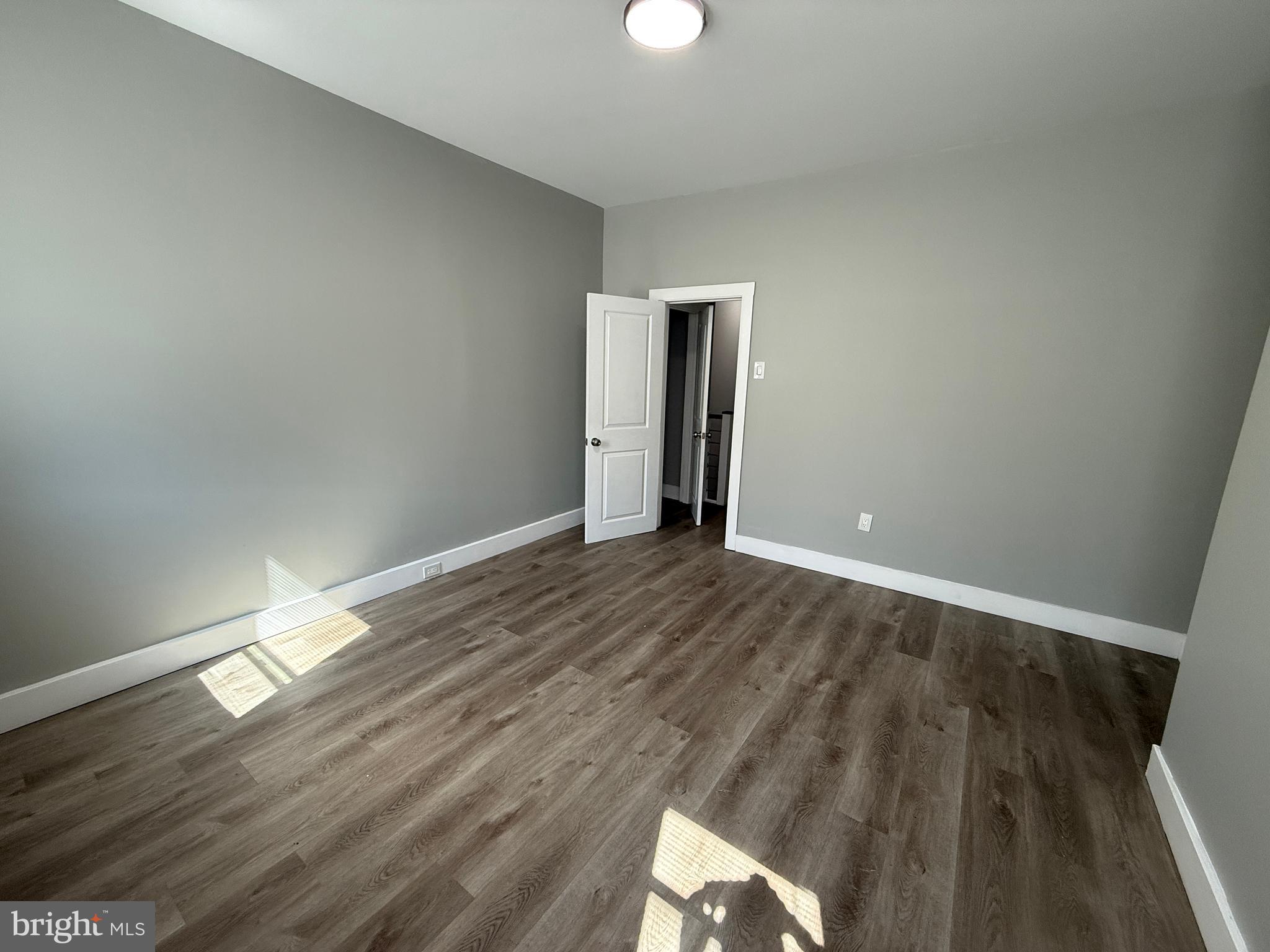 2943 Wharton Street Philadelphia, PA 19146 - Photo 24 of 36 a view of empty room with wooden floor
