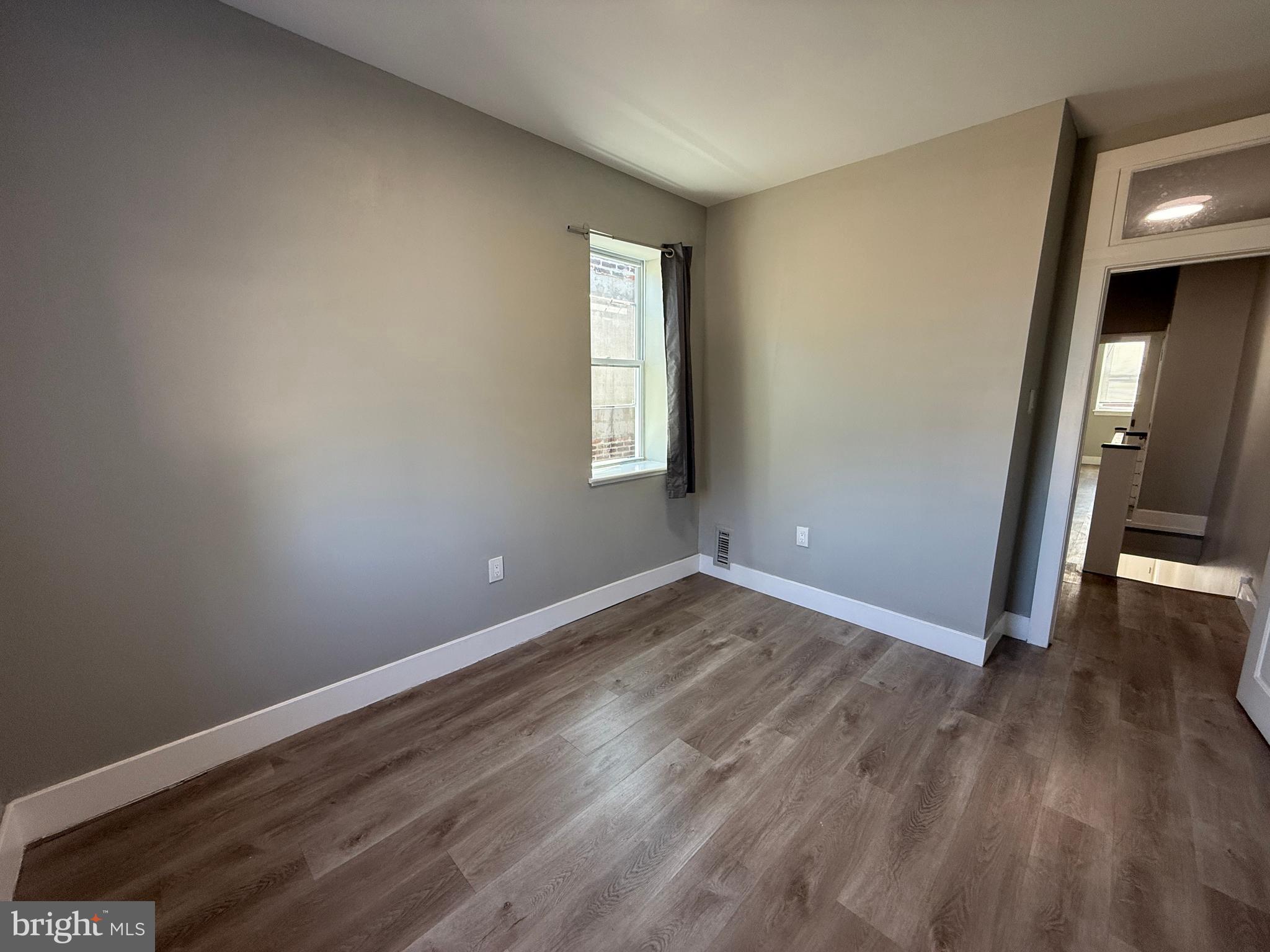 2943 Wharton Street Philadelphia, PA 19146 - Photo 28 of 36 a view of empty room with wooden floor and fan