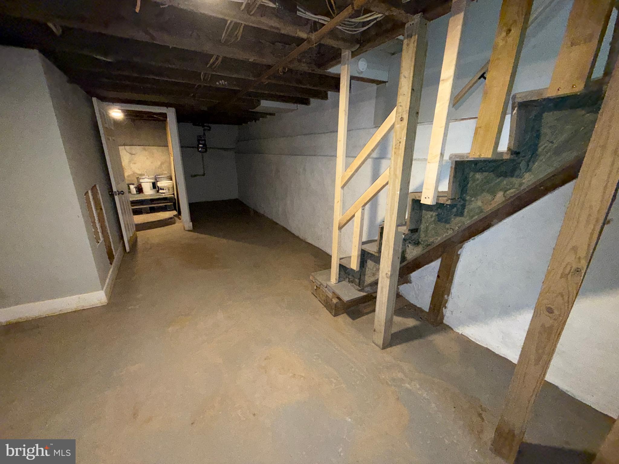 2943 Wharton Street Philadelphia, PA 19146 - Photo 33 of 36 a view of an empty room with wooden stairs