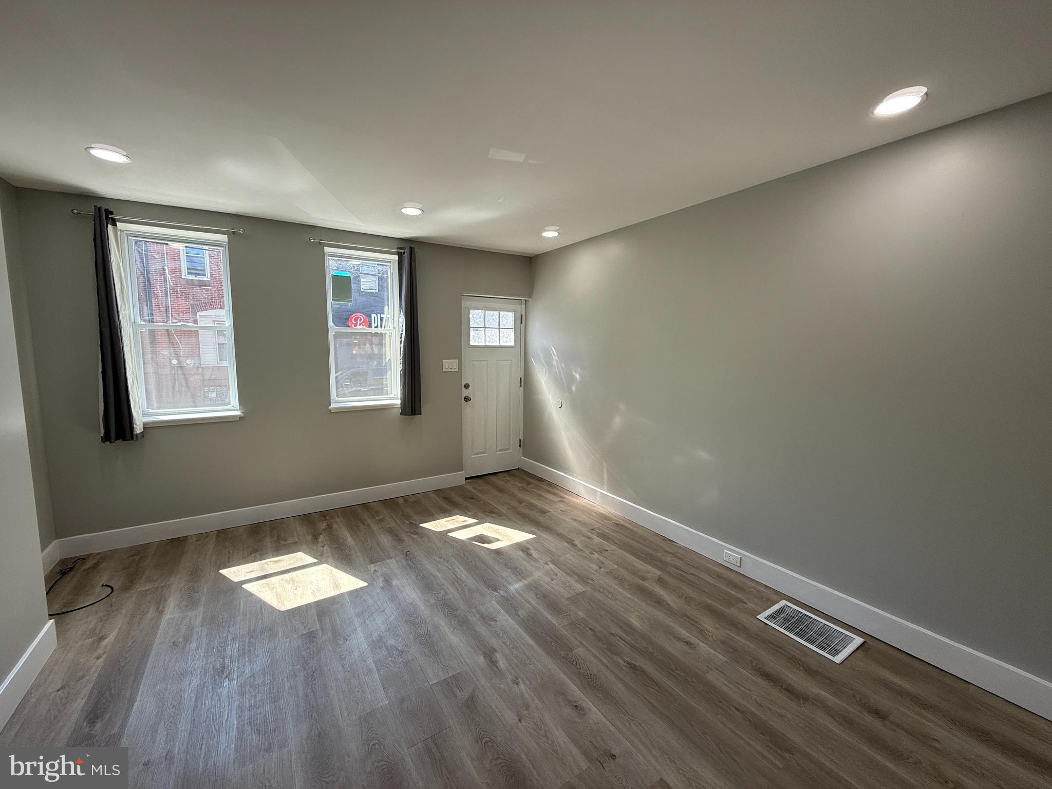 2943 Wharton Street Philadelphia, PA 19146 - Photo 6 of 36 a view of empty room with wooden floor and fan