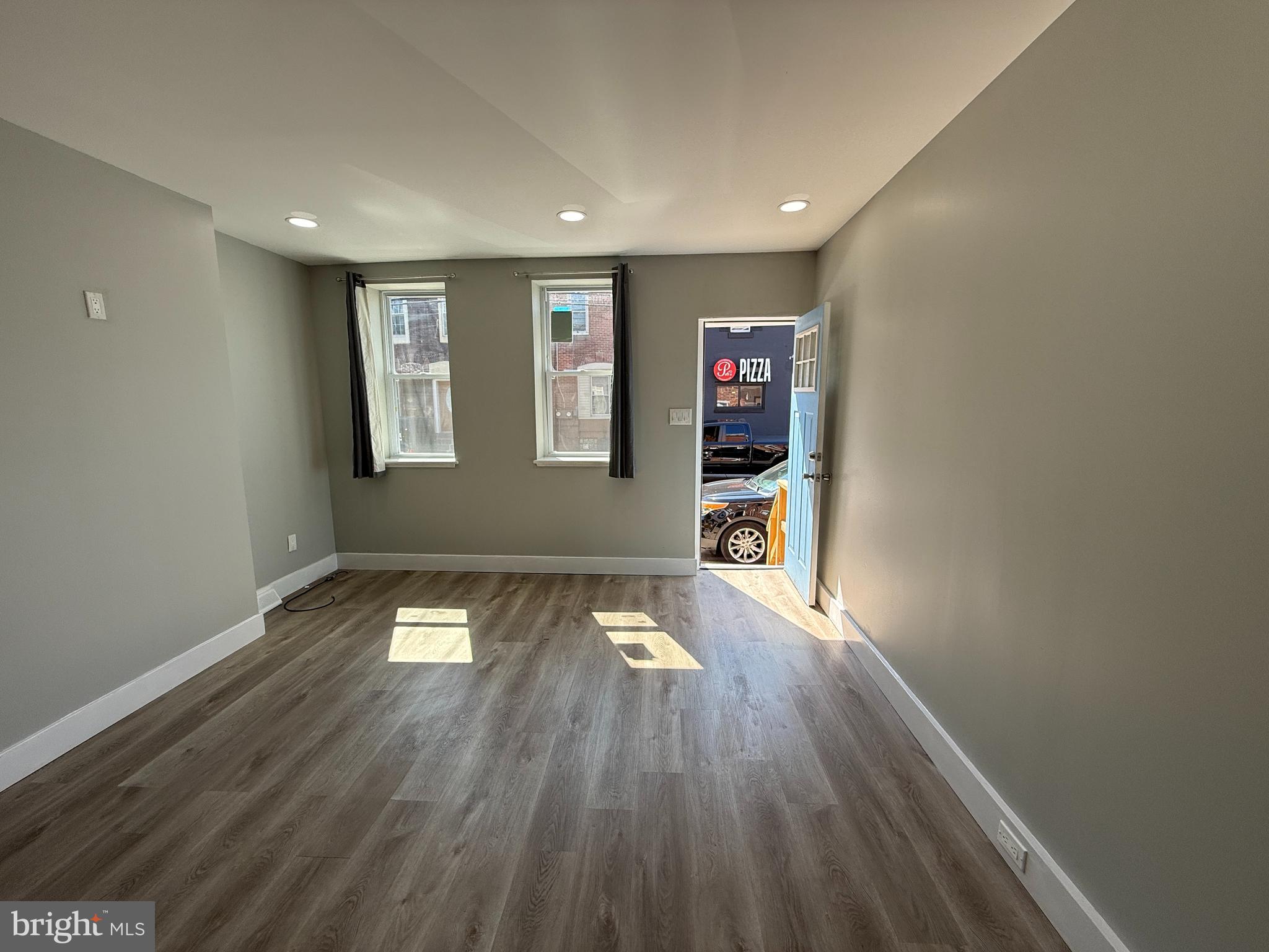 2943 Wharton Street Philadelphia, PA 19146 - Photo 7 of 36 a view of empty room with wooden floor and fan