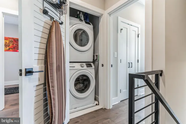 a view of a hallway with washer and dryer
