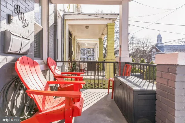 a balcony with an outdoor seating