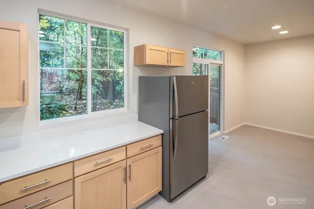 a white refrigerator freezer sitting in a kitchen