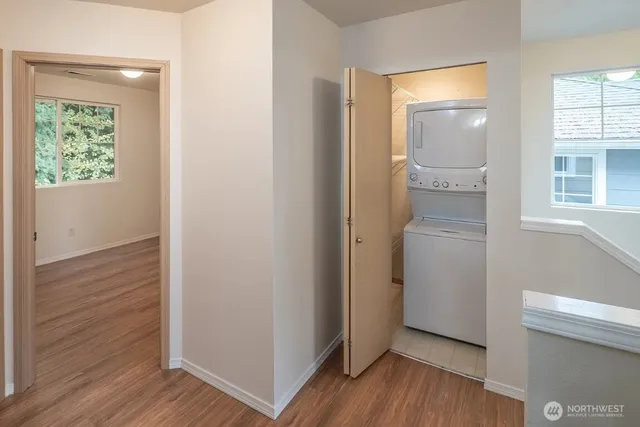 a view of hallway with wooden floor