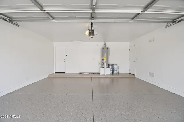 a bathroom with a sink a toilet and a large mirror