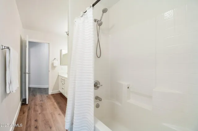 a white bath tub sitting next to a window
