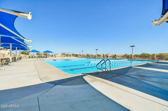 a view of swimming pool with lounge chair