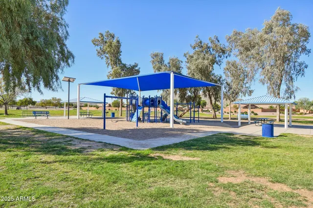 a view of a street with a yard