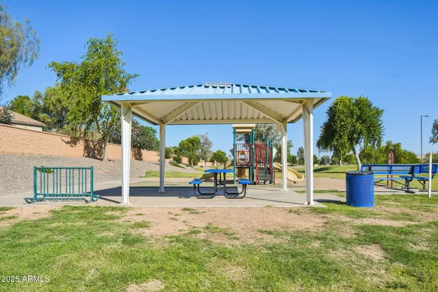 a view of a swimming pool with a lounge chairs