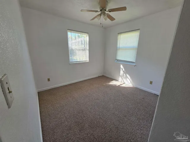 a view of empty room with windows
