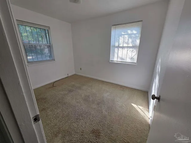 an empty room with windows