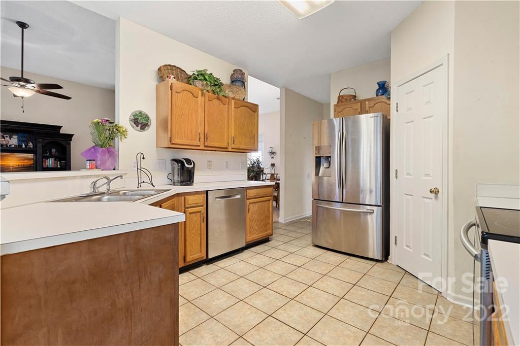 7001 Reedy Creek Road Charlotte, NC 28215 - Photo 11 of 24 a kitchen with a sink appliances and cabinets