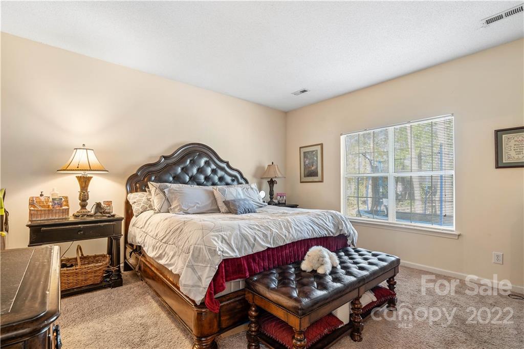 7001 Reedy Creek Road Charlotte, NC 28215 - Photo 18 of 24 a bedroom with a bed window and a couch