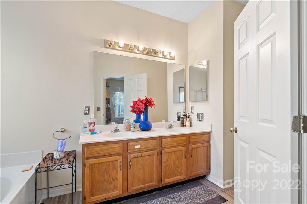 7001 Reedy Creek Road Charlotte, NC 28215 - Photo 19 of 24 a bathroom with a sink and a mirror
