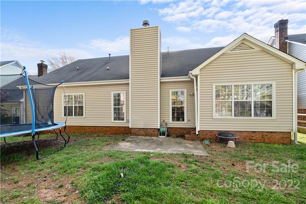 7001 Reedy Creek Road Charlotte, NC 28215 - Photo 21 of 24 a backyard of a house with outdoor seating